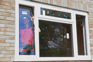 guy installing window