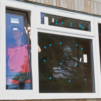 guy installing window