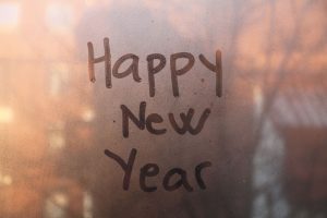 happy new year written on window