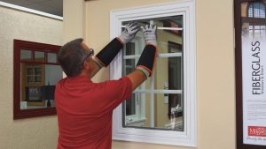 guy replaces fiberglass window