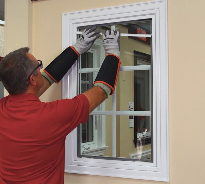 guy replaces fiberglass window